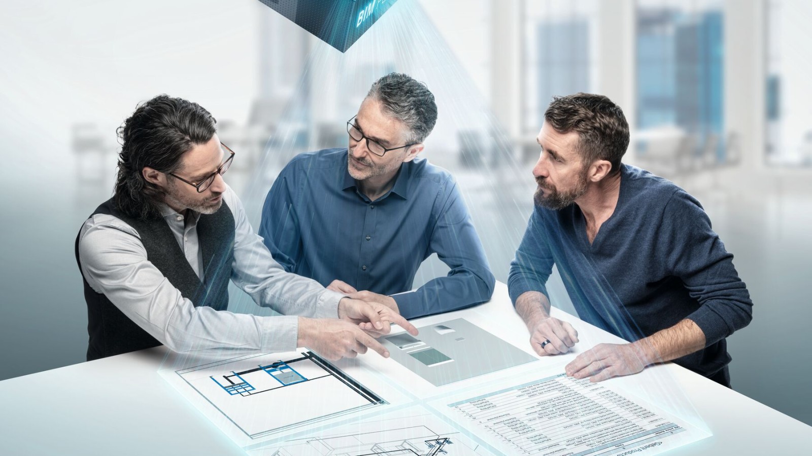 Des planificateurs en pleine discussion autour d'une table avec un symbole BIM